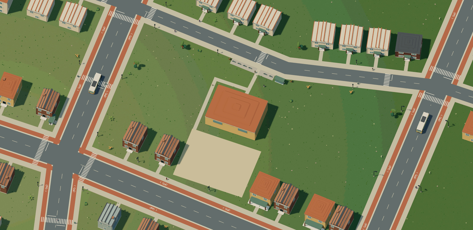 A paved route around the primary school reaches its rear yard